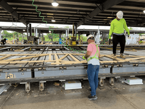 Two-Workers-Building-Wood-Panel-min